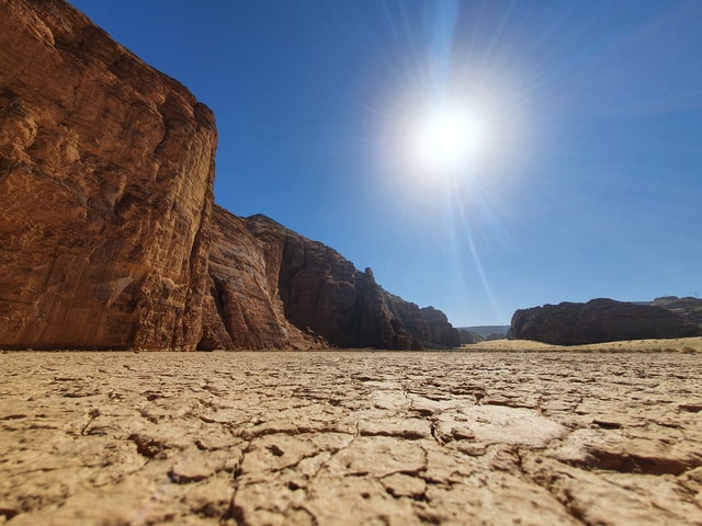 An image of The blazing sun in the sky of the Royal Saudi Arabia in the summer.